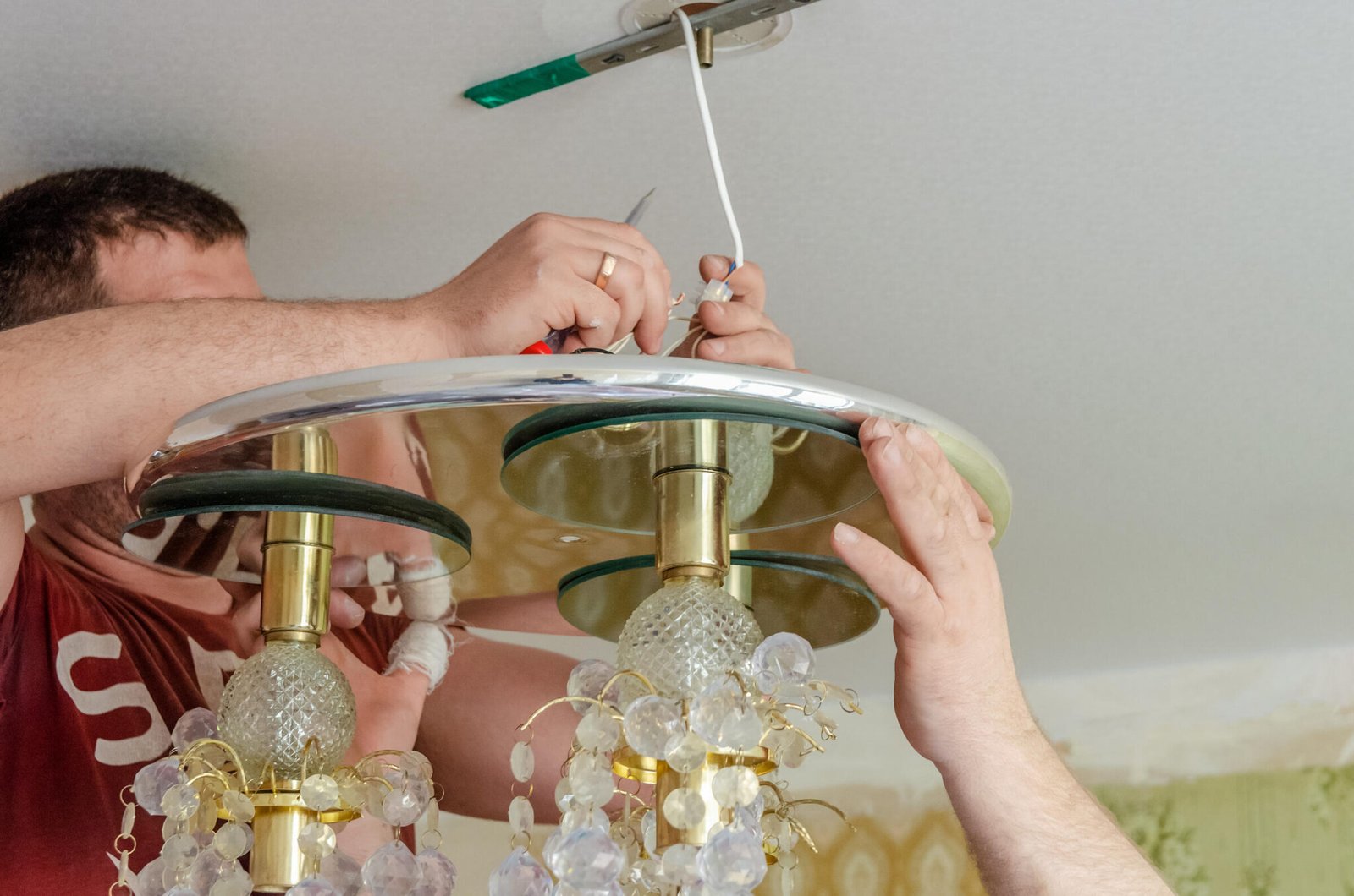 Chandelier Installatin: close-up of a properly load-rated chandelier mounting bracket