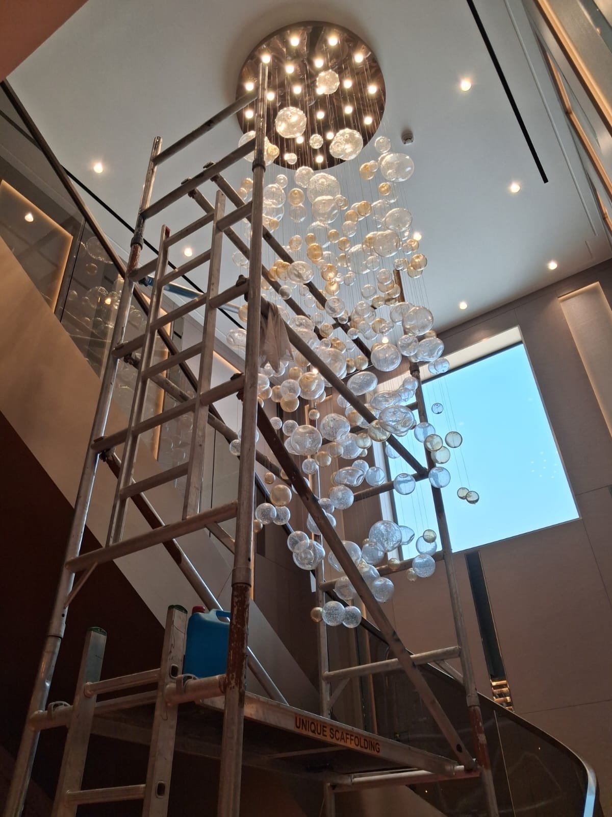 crystal chandelier installation in a Palm Jumeirah villa