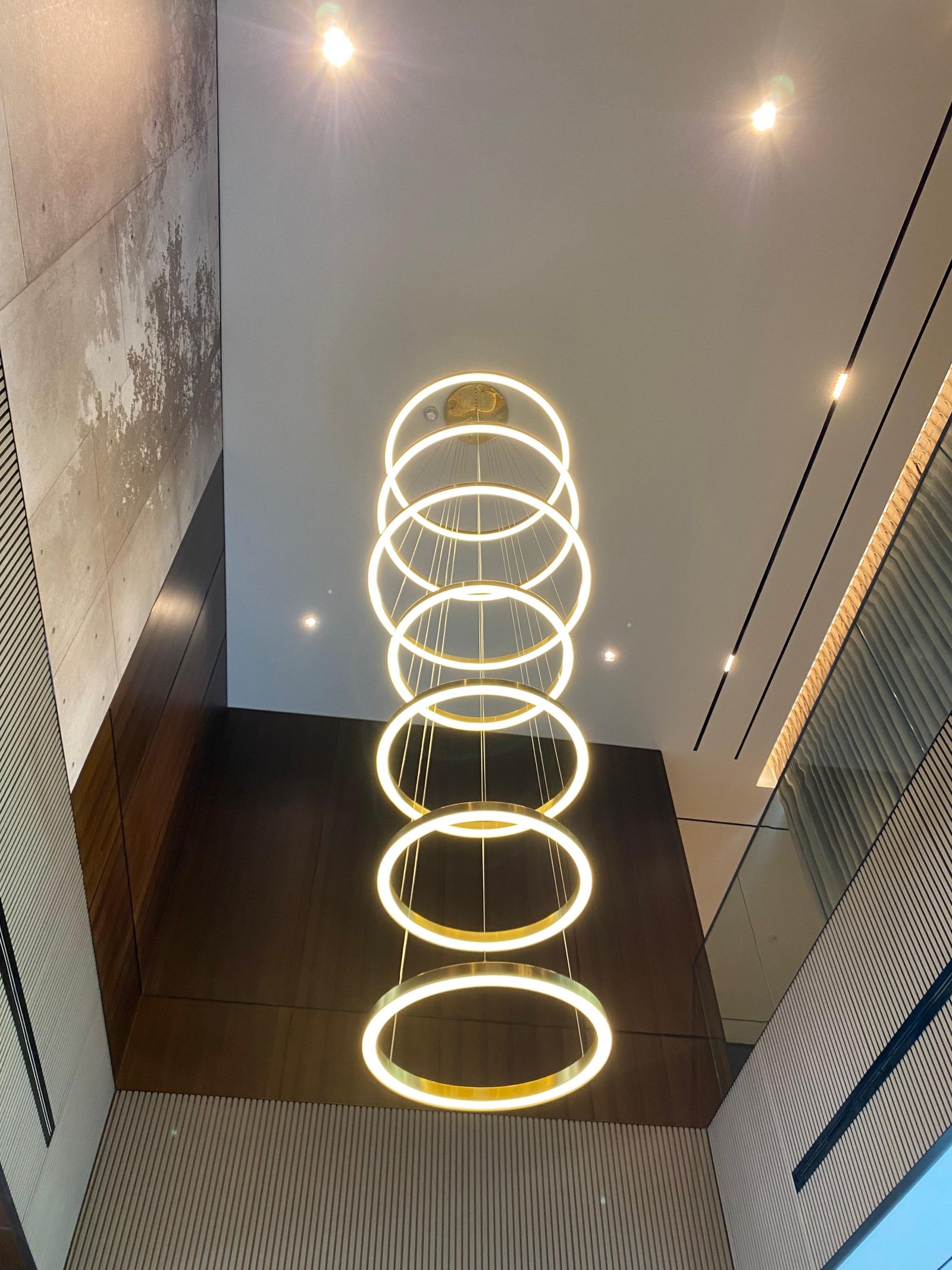 staircase chandelier installation, Dubai Hills Estate