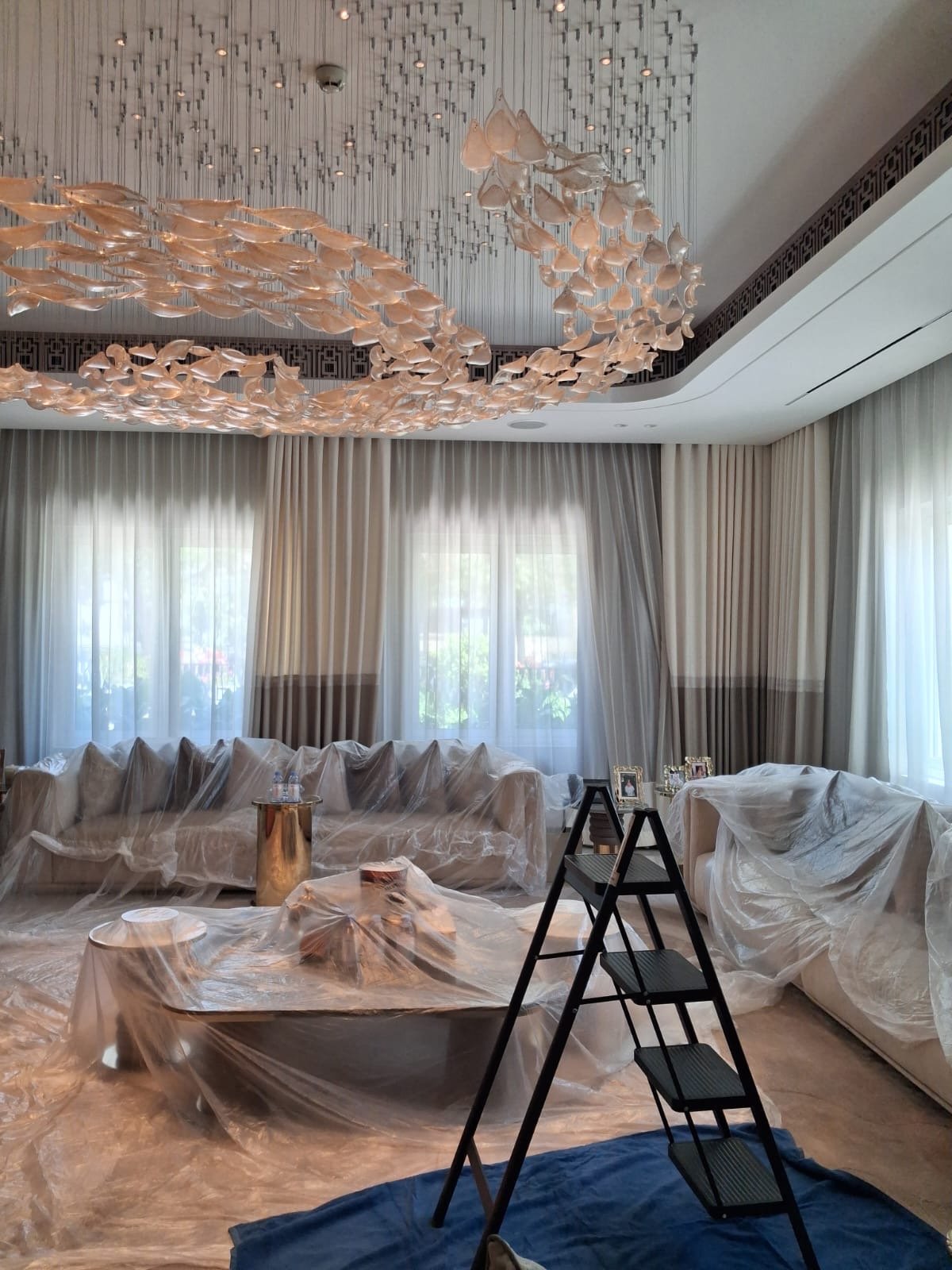 multi-tier chandelier installation, Emirates Hills villa